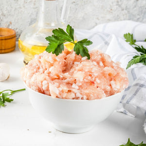 Bowl of ground chicken thigh with parsley on a white surface - 澳洲無激素免治雞髀肉(400克)