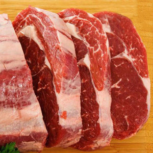 Raw beef ribeye roast scotch fillet on a wooden cutting board - 澳洲優質黑安格斯肉眼(肋眼,MS 2+,2公斤)