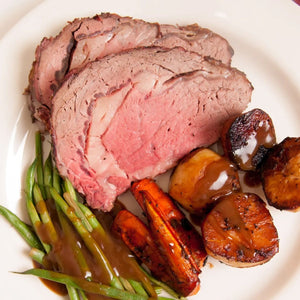 Sliced roast beef ribeye with vegetables on a white plate - 澳洲優質黑安格斯肉眼(肋眼,MS 2+,2公斤)