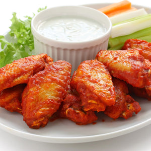 Platter of buffalo wings with a side of ranch dressing, carrots, and celery on a white plate. - EU Hormone Free Chicken Mid-Wings (908g)