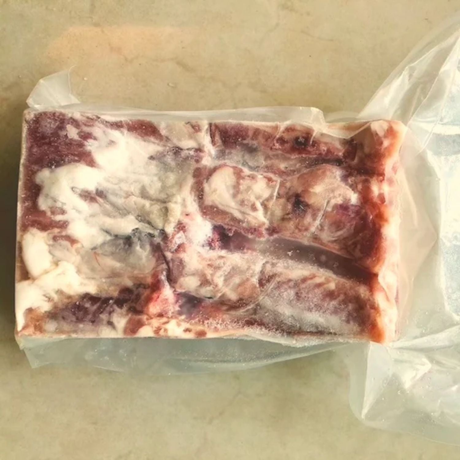 Packaged raw pork belly on a beige surface - EU Hormone Free Pork Belly Rind-On (1kg)