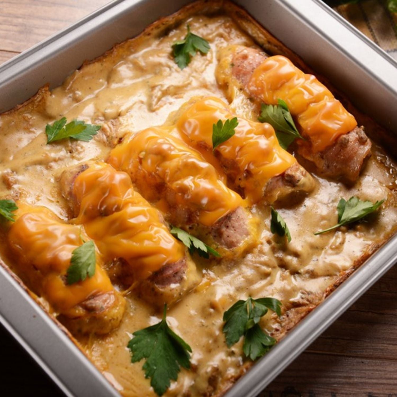 Baked dish with cheese-wrapped meatballs made from pork shoulder and parsley on a wooden surface - 歐盟無激素梅花肉(肩膀)(2公斤)|九五折