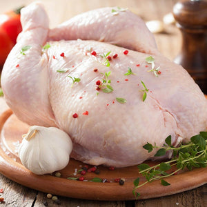 Raw chicken on a wooden board with garlic and herbs - EU Hormone Free Whole Chicken (1.7kg)