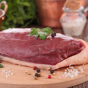 Raw duck breast on a wooden cutting board with spices and herbs - 無激素法國無骨連皮番鴨胸
