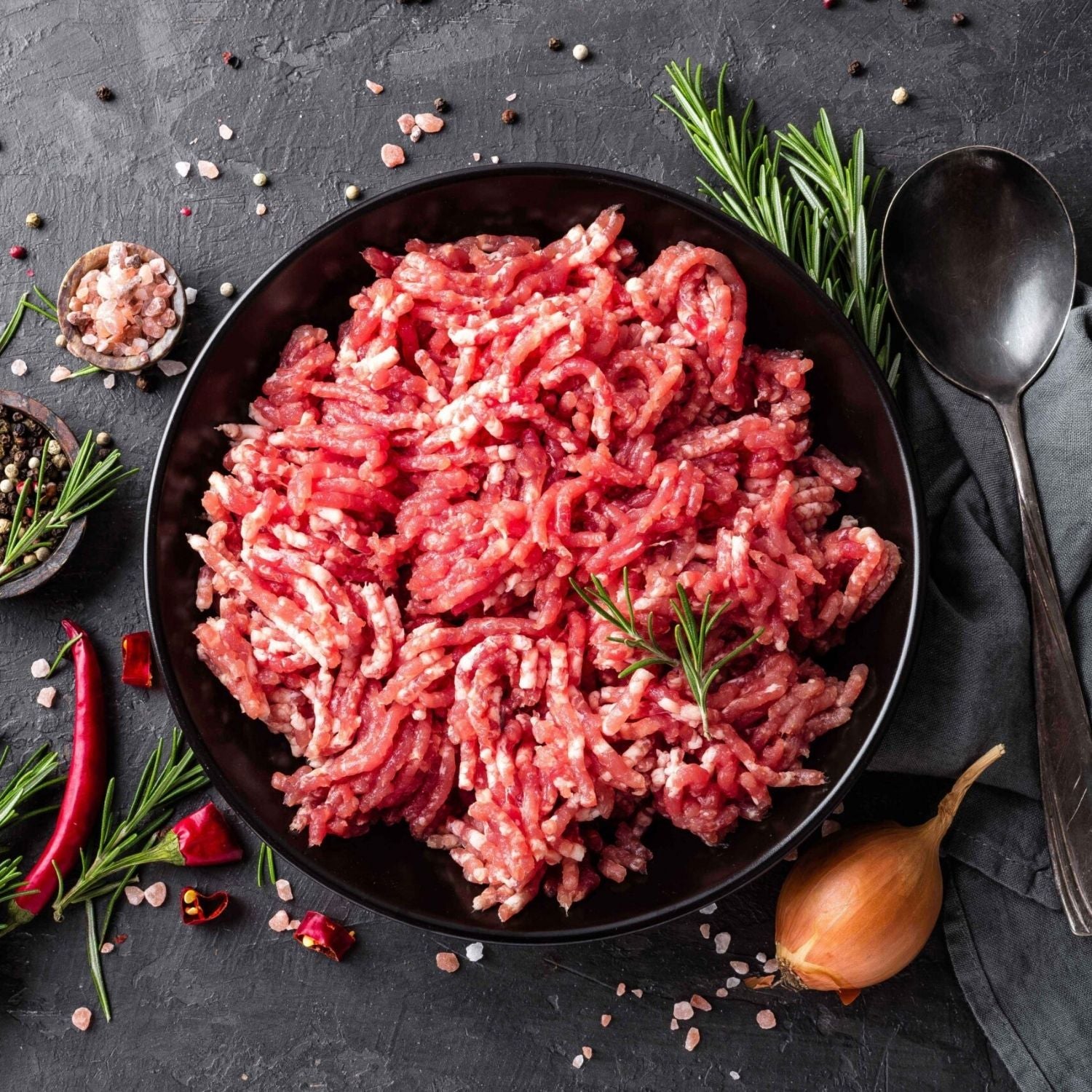 Minced pork in a black bowl with herbs and spices on a dark surface - UK Premium Duroc Pork Mince & Hormone Free (300g)