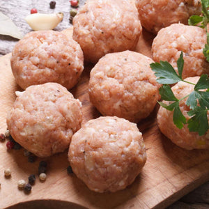 Raw meatballs on a wooden board with herbs and spices - UK Premium Duroc Pork Mince & Hormone Free (300g)