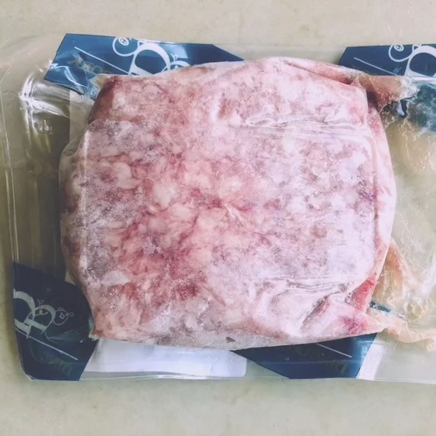 Raw minced pork in a clear plastic packaging on a white surface - UK Premium Duroc Pork Mince & Hormone Free (300g)