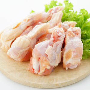 Raw chicken drumettes on a wooden cutting board with green lettuce leaves. - Wholesale Australian Hormone Free Chicken Drumettes (400g) | Buy 20 Get 6 Free