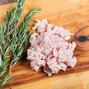Raw ground chicken thigh on a wooden cutting board with rosemary - 澳洲無激素免治雞髀肉(400克)|買二十送六